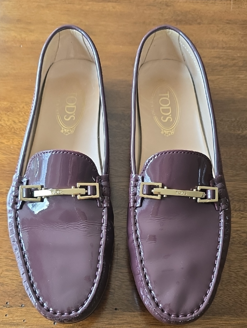 Tod's Patent Leather Loafers in Deep Plum with Gold Hardware
